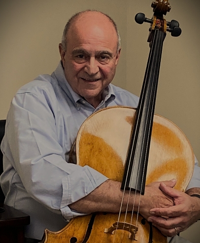 Man holding cello in arms
